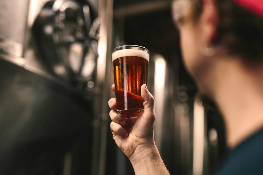 Craft beer taps at a small microbrewery taproom in the Tuscan countryside