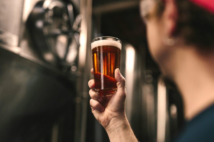 Craft beer taps at a small microbrewery taproom in the Tuscan countryside