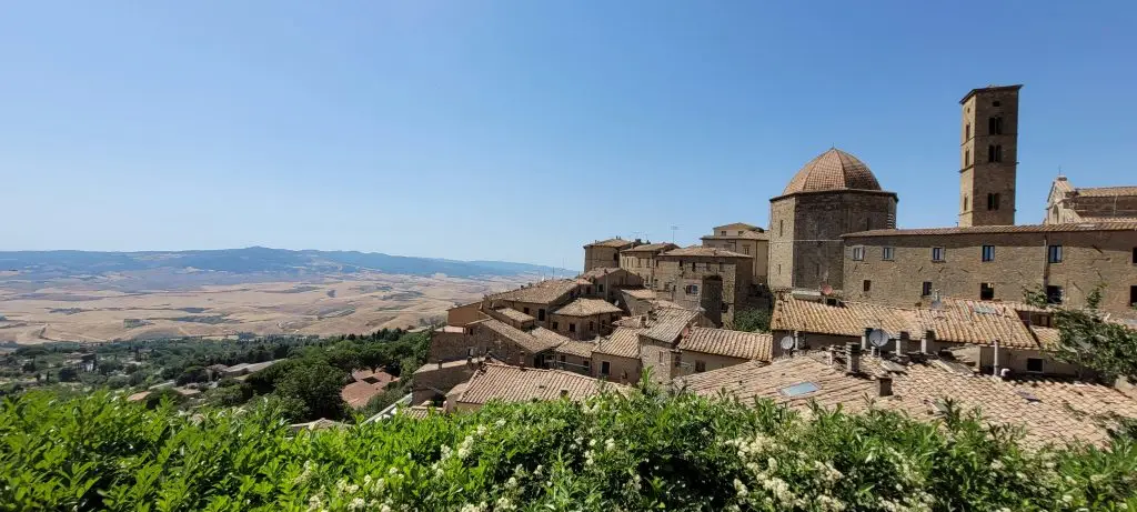 Etruscan stone walls and hilltop rooftops of Volterra, Tuscany, seen on a quiet autumn morning